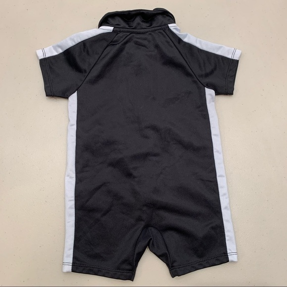 Puma One Piece 18M 1/2 zip Black Short Sleeve - Picture 2 of 4